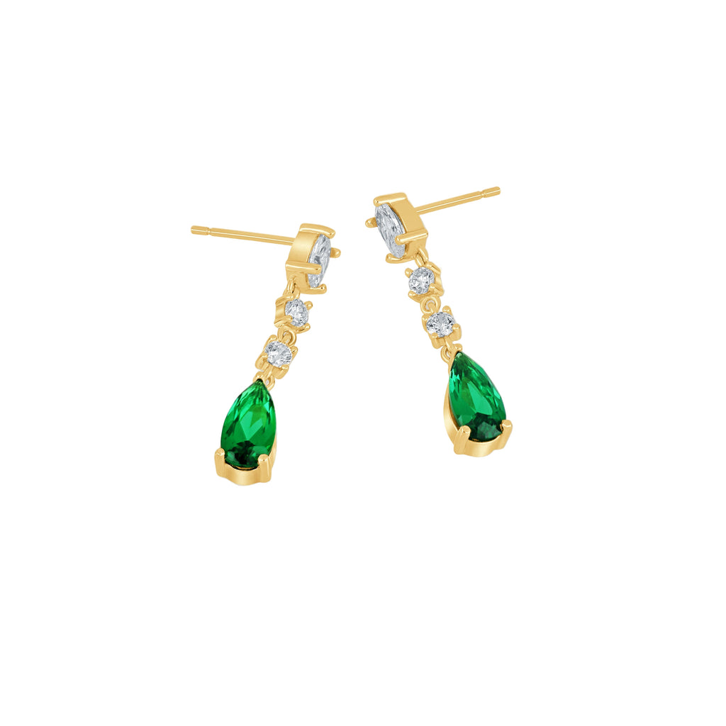 Gold earrings with green gemstones on a white background